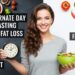 Alternate Day Fasting for Fat Loss Smiling woman holds a bowl of salad and a clock, illustrating alternate day fasting. Left side shows a feast of colorful dishes, right side shows fasting foods.